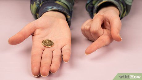صورة عنوانها Do a Simple Coin Magic Trick Step 6