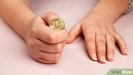 صورة عنوانها Do a Simple Coin Magic Trick Step 15